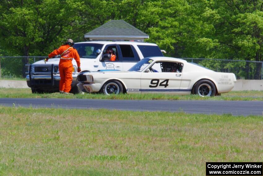 The rescue team comes to the aid of Brian Kennedy's Ford Shelby GT350, stalled at turn 4.