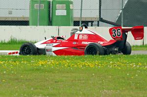 Steve Flaten's Star Formula Mazda pulls off course at turn 12.