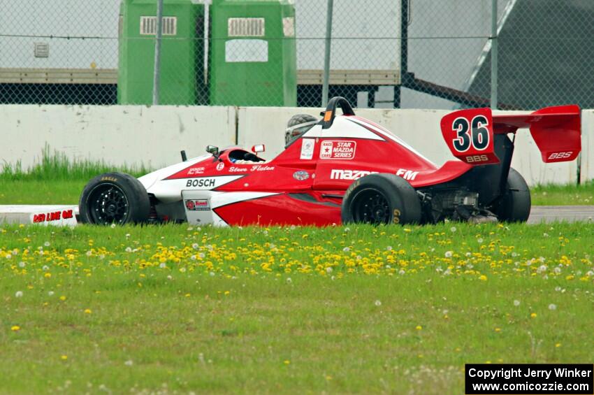 Steve Flaten's Star Formula Mazda pulls off course at turn 12.