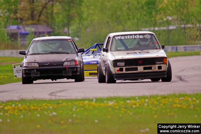 Jimmy Griggs' H Production VW Rabbit and Tim Stone's ITJ Honda Civic