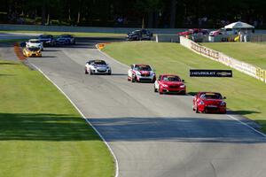 The TC field streams through the Hurry Downs on lap 1.