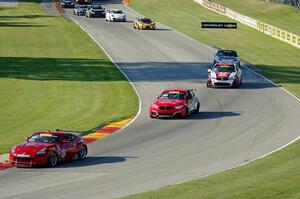 The TC field streams through the Hurry Downs on lap 1.