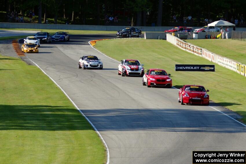 The TC field streams through the Hurry Downs on lap 1.