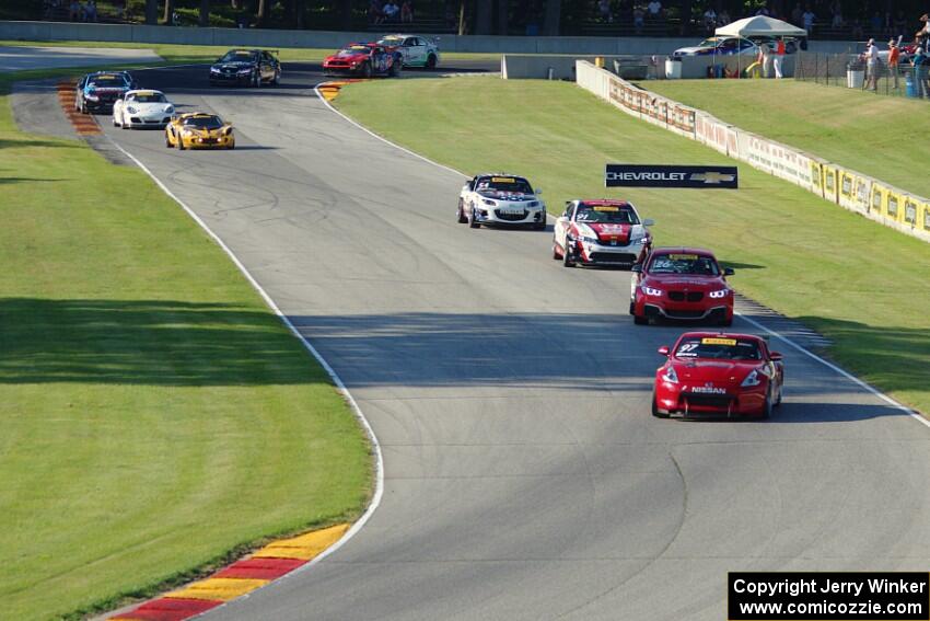 The TC field streams through the Hurry Downs on lap 1.