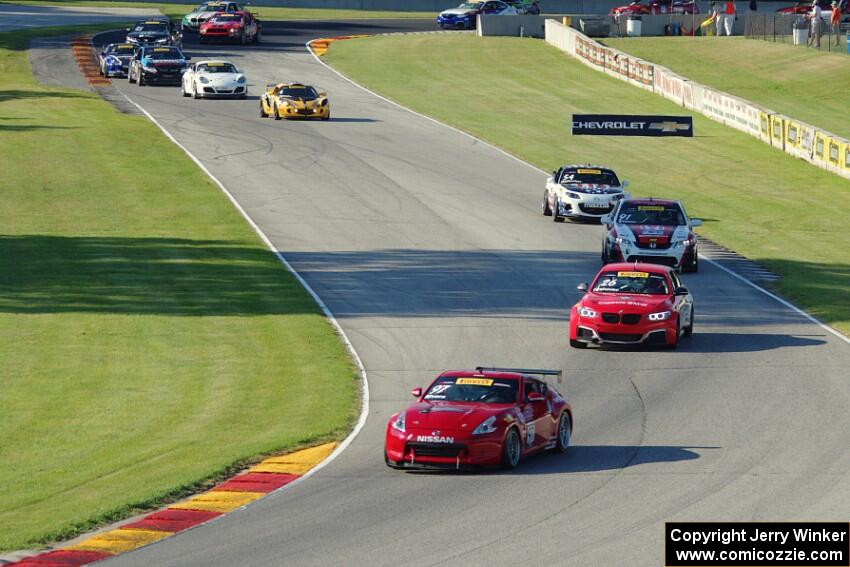 The TC field streams through the Hurry Downs on lap 1.