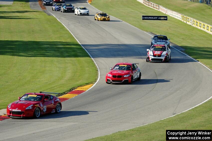 The TC field streams through the Hurry Downs on lap 1.