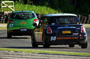 Travis Washay's MINI Cooper chases Blake Thompson's Mazda 2