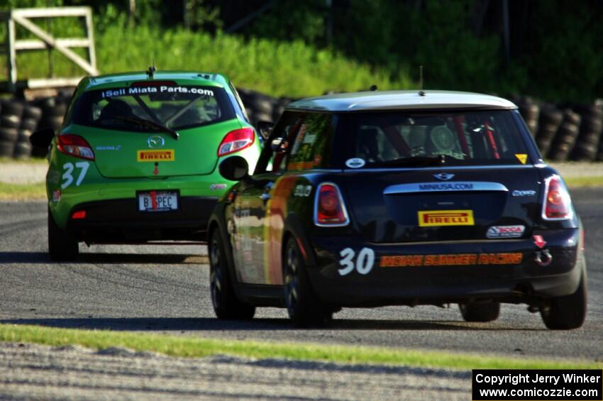 Travis Washay's MINI Cooper chases Blake Thompson's Mazda 2