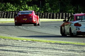 Tony Rivera's Nissan 370Z leads Toby Grahovec's BMW M235iR