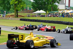 Félix Serrallés gets into the back of Ed Jones as Santiago Urrutia gets past for the lead exiting turn 6. All cars are Dallara I