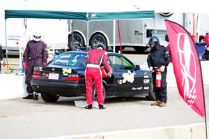 Noobman Racing BMW 325is in the pits.