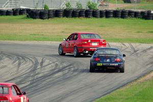 Ambitious But Rubbish Racing BMW 325 and 50 Shades of Blue Mazda Miata