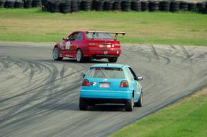 In the Red 1 BMW M3 and Blue Sky Racing VW Golf
