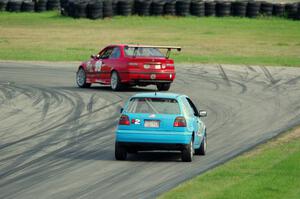 In the Red 1 BMW M3 and Blue Sky Racing VW Golf