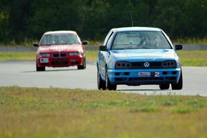 Blue Sky Racing VW Golf and Ambitious But Rubbish Racing BMW 325