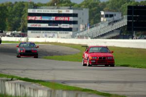 In the Red 1 BMW M3 and North Loop Motorsports BMW 323is