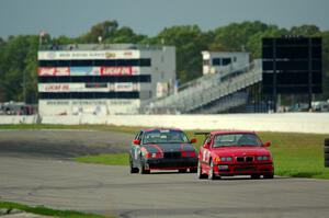 In the Red 1 BMW M3 and North Loop Motorsports BMW 323is