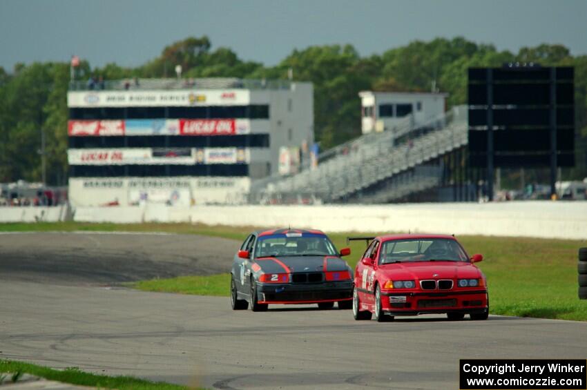 In the Red 1 BMW M3 and North Loop Motorsports BMW 323is