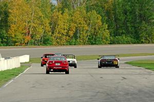 Five cars head down the front straight into turn 1.