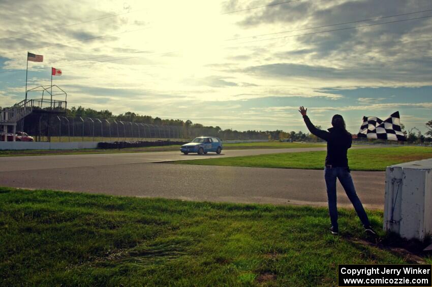 Blue Sky Racing VW Golf takes the checkered flag.