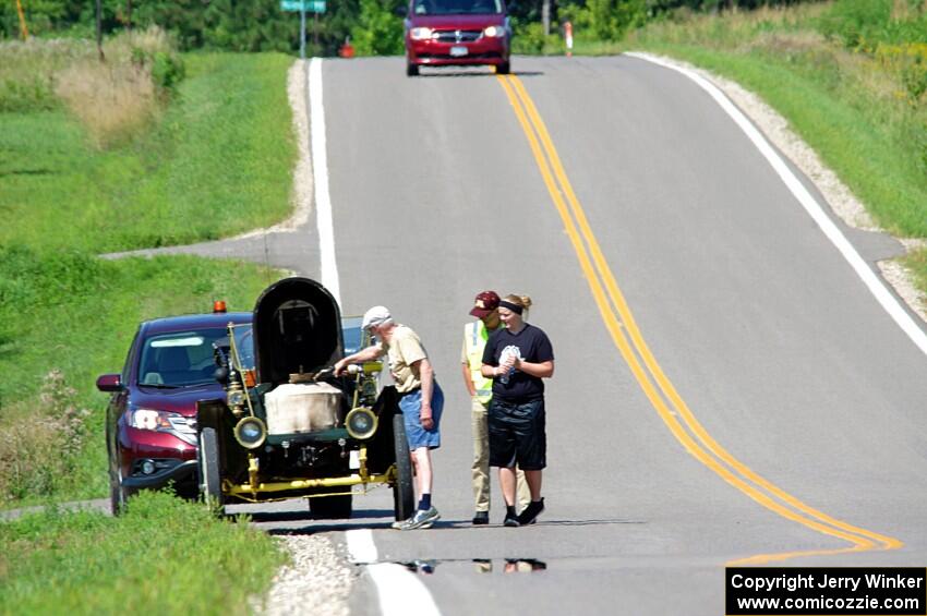 Gil Fitzhugh's 1907 Stanley Steamer stops for a brief fix.