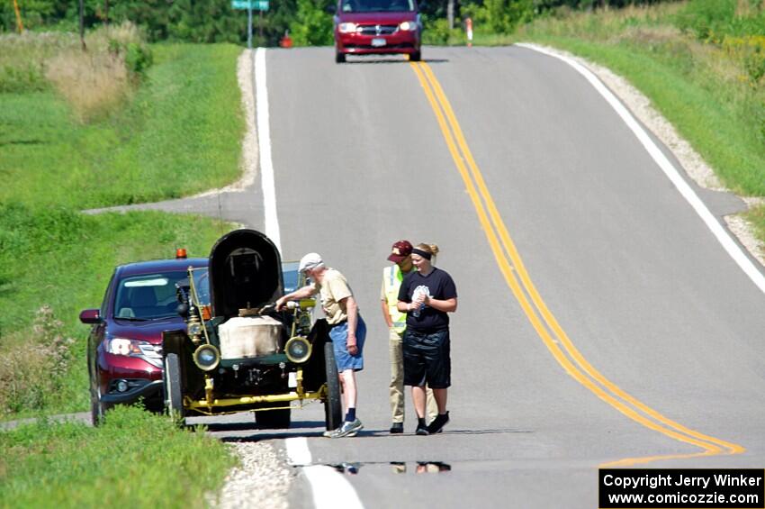 Gil Fitzhugh's 1907 Stanley Steamer stops for a brief fix.