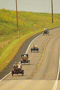 Jerry Kramer's 1906 Cadillac, Ron Fishback's 1912 Maxwell, Vince Smith's 1912 Maxwell and Brian Heyd's 1907 Cadillac