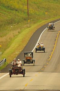 Jerry Kramer's 1906 Cadillac, Ron Fishback's 1912 Maxwell, Vince Smith's 1912 Maxwell and Brian Heyd's 1907 Cadillac