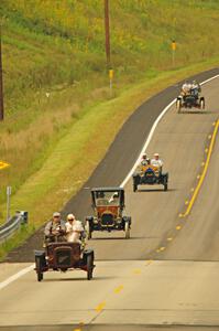 Jerry Kramer's 1906 Cadillac, Ron Fishback's 1912 Maxwell, Vince Smith's 1912 Maxwell and Brian Heyd's 1907 Cadillac