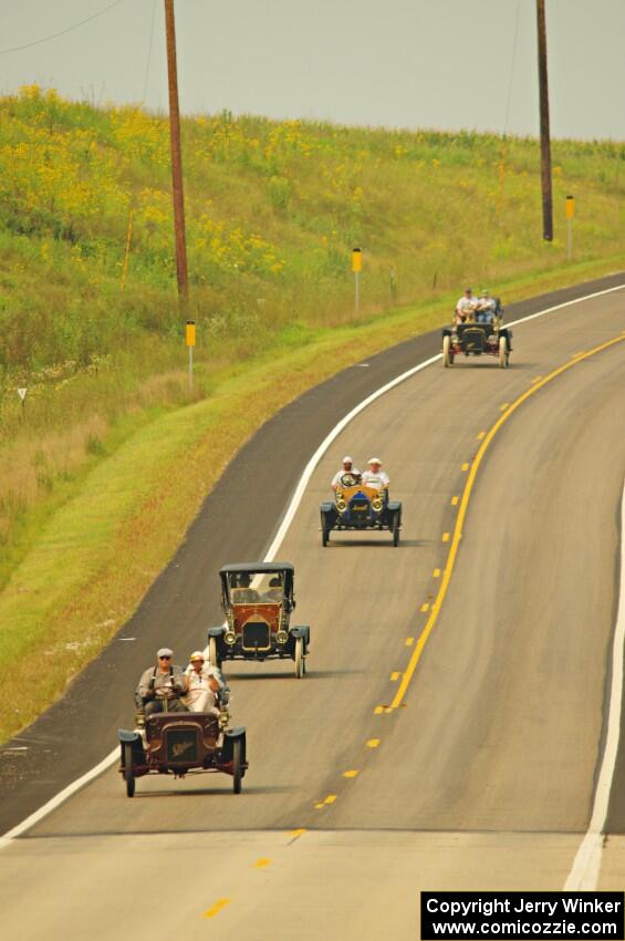 Jerry Kramer's 1906 Cadillac, Ron Fishback's 1912 Maxwell, Vince Smith's 1912 Maxwell and Brian Heyd's 1907 Cadillac