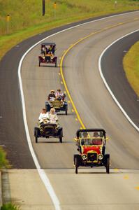Jim Laumeyer's 1910 Maxwell, Peter McIntyre's 1906 Cadillac, and Floyd Jaehnert's 1908 Ford