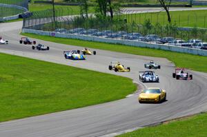 The field streams into turns ten and eleven on the pace lap.