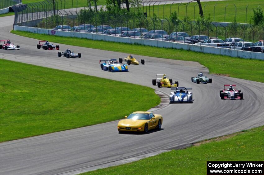 The field streams into turns ten and eleven on the pace lap.