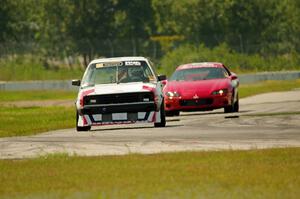 Virtually Worthless VW Golf and Blue Bayou Chevy Camaro