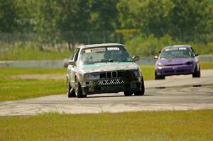 Chump Faces BMW 325is and Plum Crazy Plymouth Neon