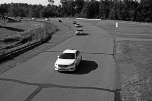 Behind the pace car at the start: Dirty Side Down Racing BMW 325i, Crank Yankers Racing BMW 325i, Just in Time Toyota MR2, etc.