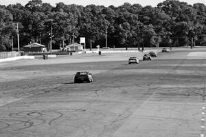 Five cars head down the Kinnard Straight.
