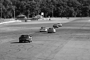 Five cars head down the Kinnard Straight.