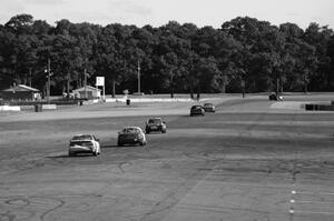 Six cars head down the Kinnard Straight and into tun 10.
