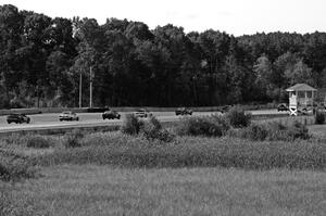The field streams through turn 2 during a caution period.