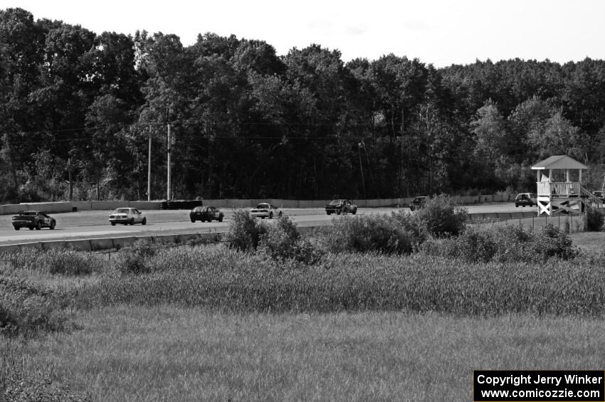 The field streams through turn 2 during a caution period.