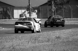 Dirty Side Down Racing BMW 325i chases rbankracing.com SAAB 9-3