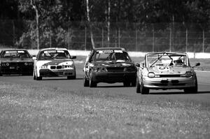Four cars head into turn 4.