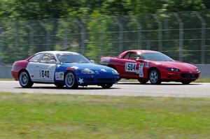 Nine Four Motorsports Lexus SC300 passes Blue Bayou Chevy Camaro