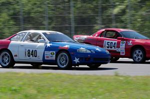 Nine Four Motorsports Lexus SC300 passes Blue Bayou Chevy Camaro