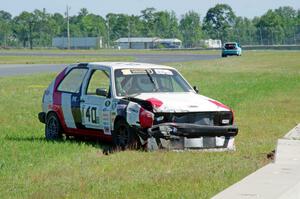 Virtually Worthless VW Golf had its day end after hitting the inside wall exiting turn 3.