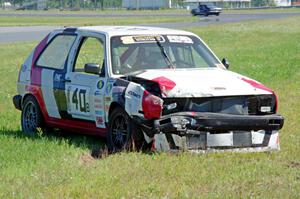 Virtually Worthless VW Golf had its day end after hitting the inside wall exiting turn 3.