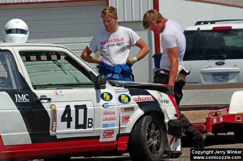 Virtually Worthless VW Golf back in the paddock after the wreck.