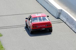 Dead Pedal Racing Maserati Biturbo ducks into the pits.