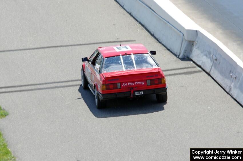 Dead Pedal Racing Maserati Biturbo ducks into the pits.